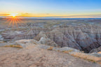 Sunset over a desert landscape with rocky formations