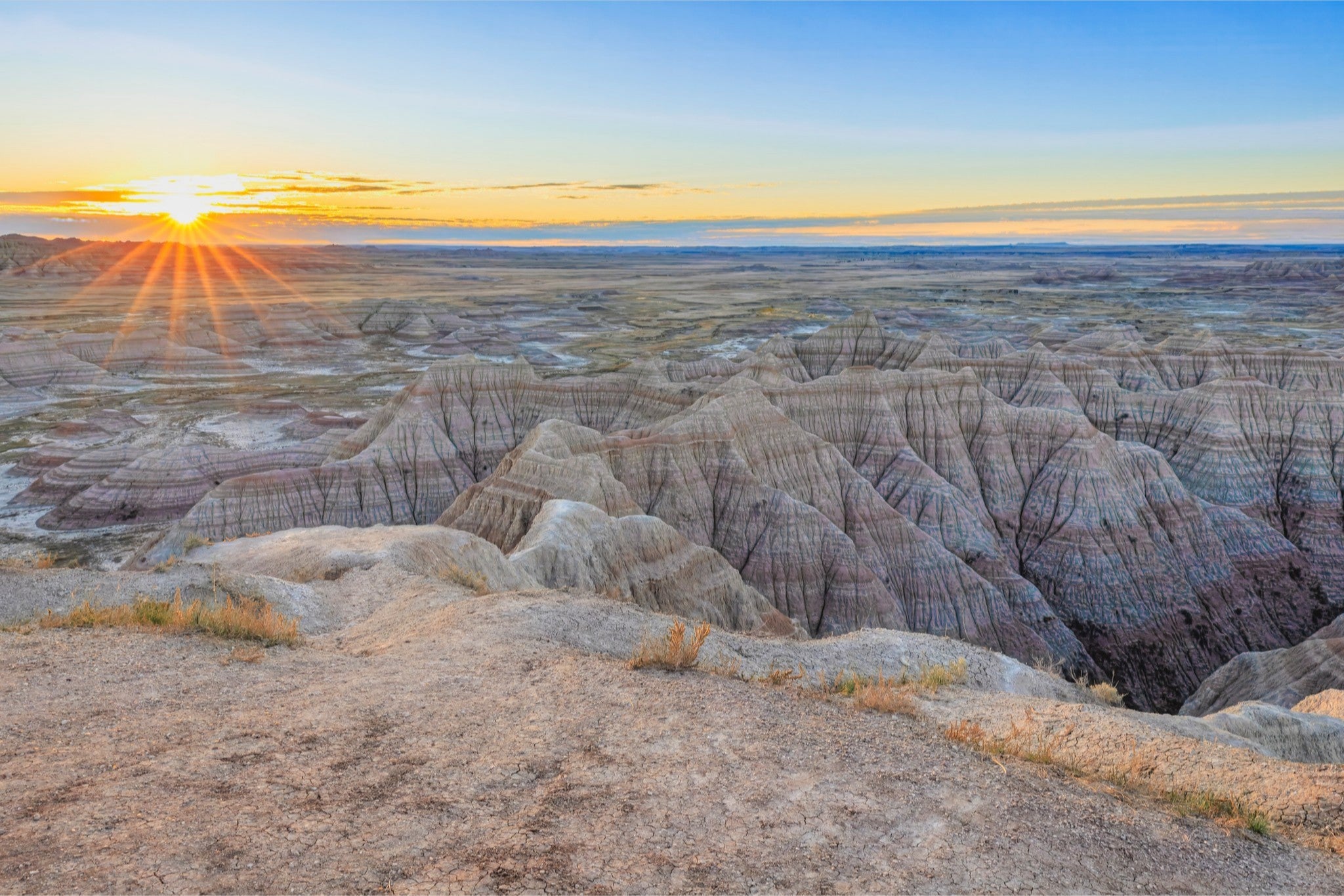 Sunset over a desert landscape with rocky formations