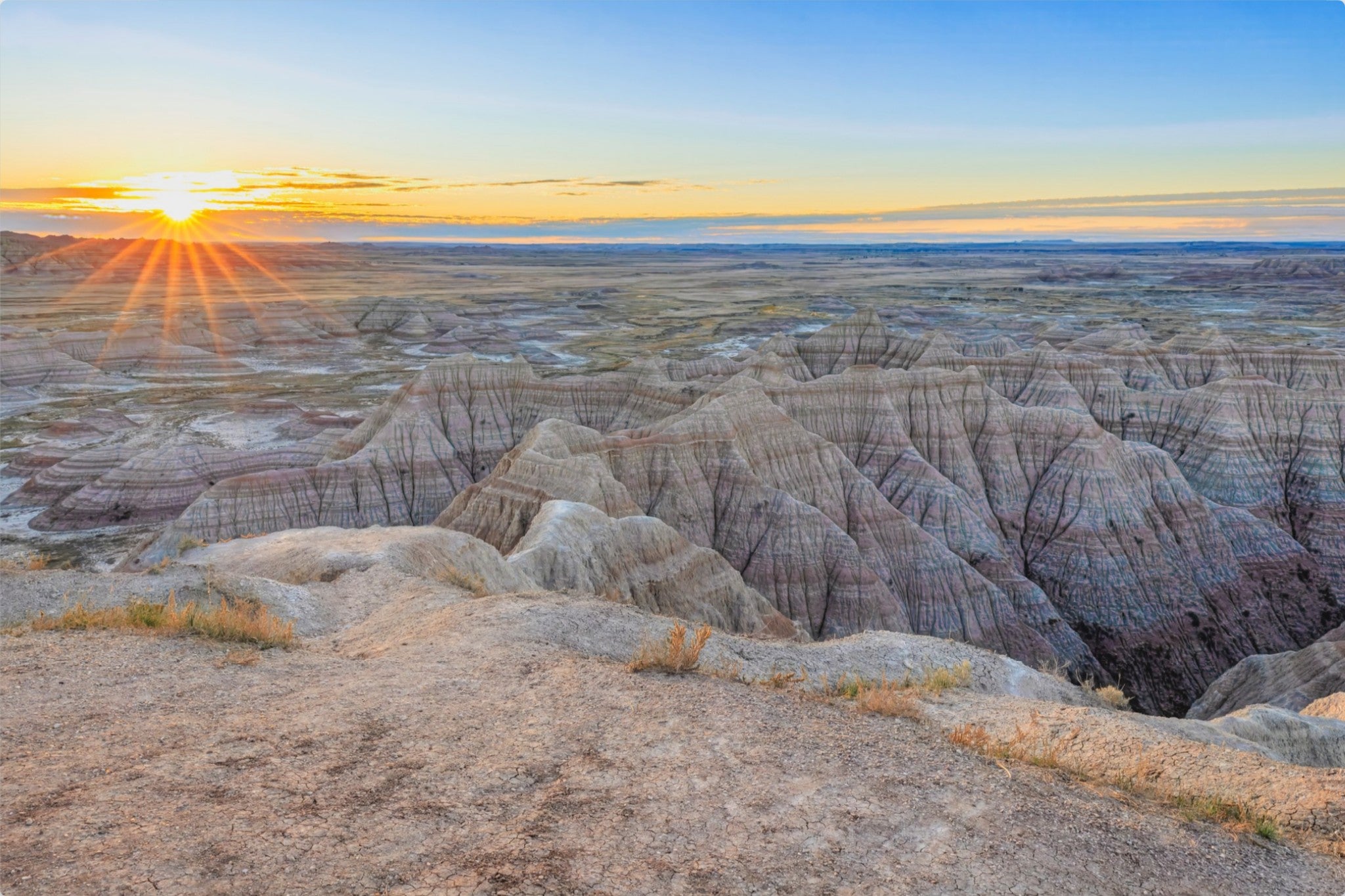 Sunset over a desert landscape with rocky formations