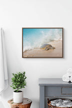 Fine art photography print of a Hawaiian green sea turtle Honu on golden sand beach with a cresting blue ocean wave.
